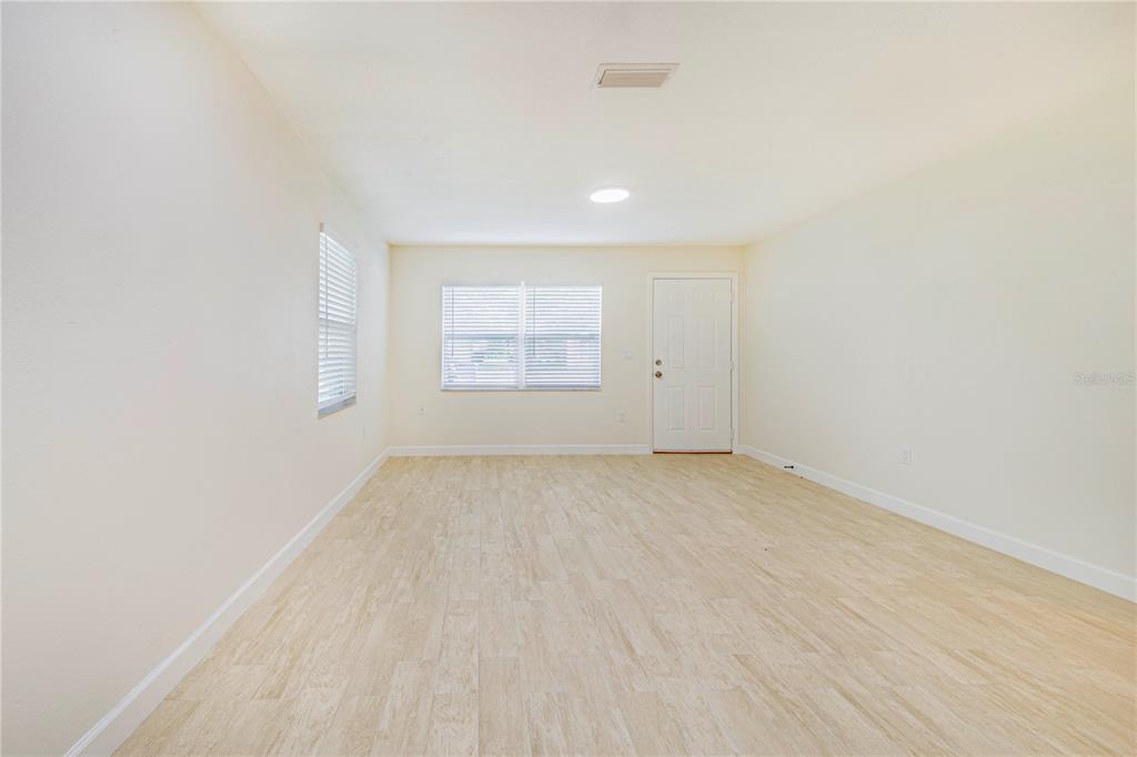 1221 Hartsell Avenue Lakeland, FL 33803 - Photo 7 of 17 an empty room with a empty space and windows