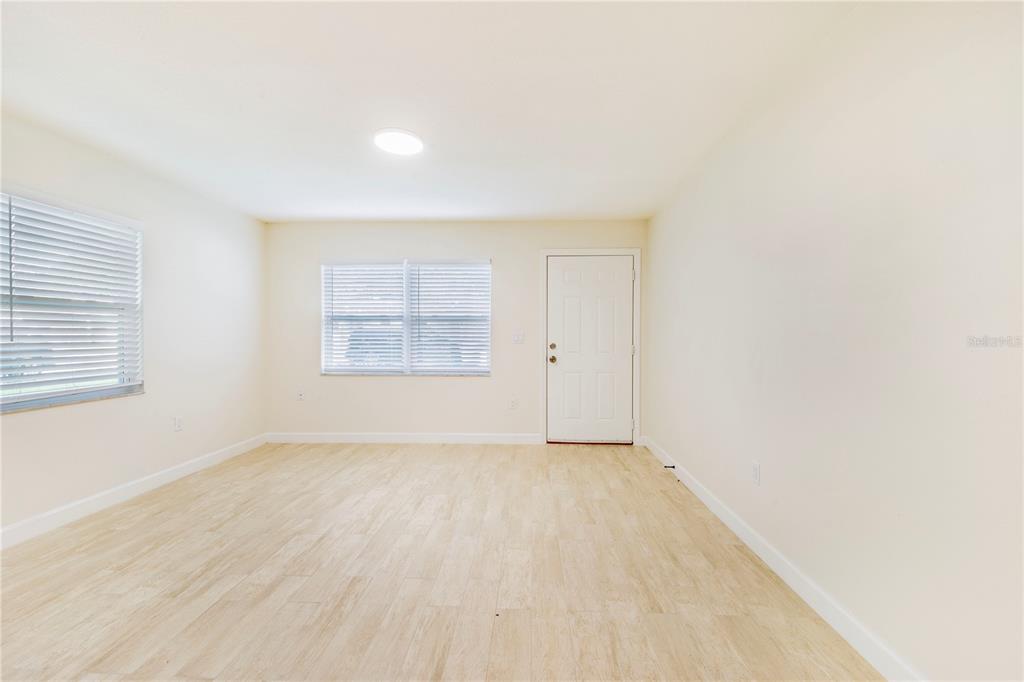 1221 Hartsell Avenue Lakeland, FL 33803 - Photo 8 of 17 an empty room with windows
