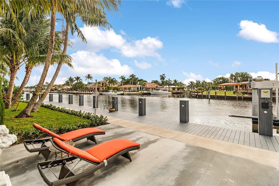a terrace with outdoor seating and city view