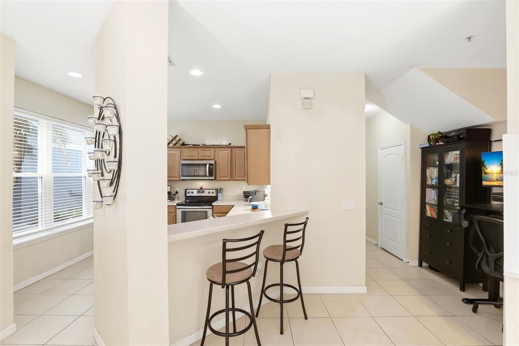 6458 South Goldenrod Road, Unit 29B Orlando, FL 32822 - Photo 12 of 40 a kitchen with stainless steel appliances a refrigerator and microwave