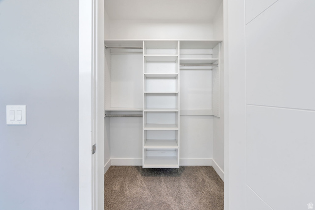 7045 South 300 East Midvale, UT 84047 - Photo 30 of 49 Integrated closet system featuring white shelving and chrome hanging rods