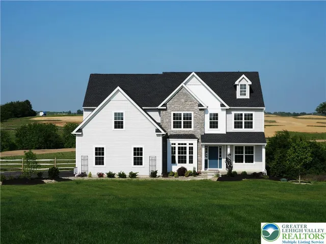 a view of a yard in front of a house with a yard