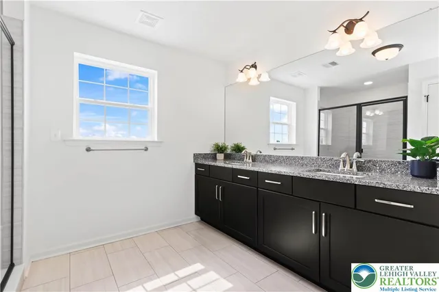 a view of a hallway with a white walls and a painting on the wall