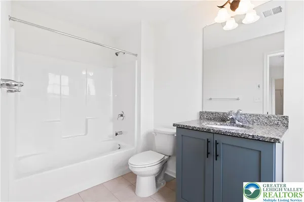 a room that has a sink and a mirror