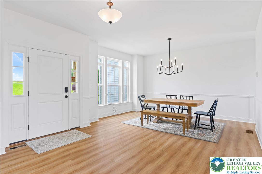 4450 Maple Street, Unit 2 Schnecksville, PA 18078 - Photo 3 of 45 a view of a room with furniture and wooden floor
