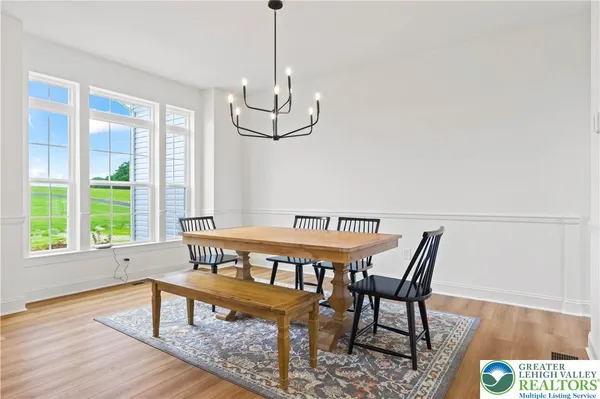 a view of a dining room with furniture window and outside view