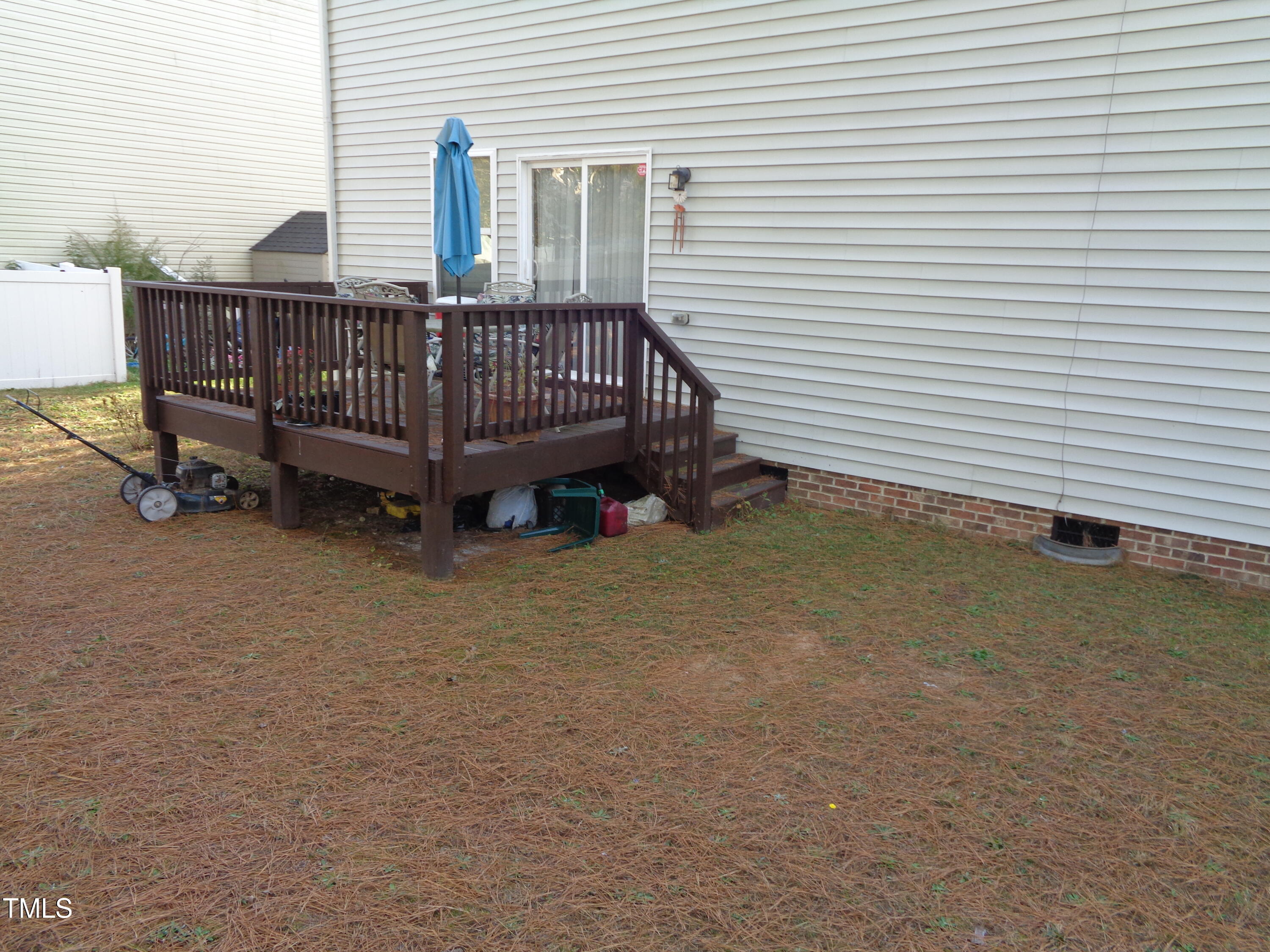 308 Switchback Street Knightdale, NC 27545 - Photo 14 of 17 a view of a deck with barbeque and wooden fence