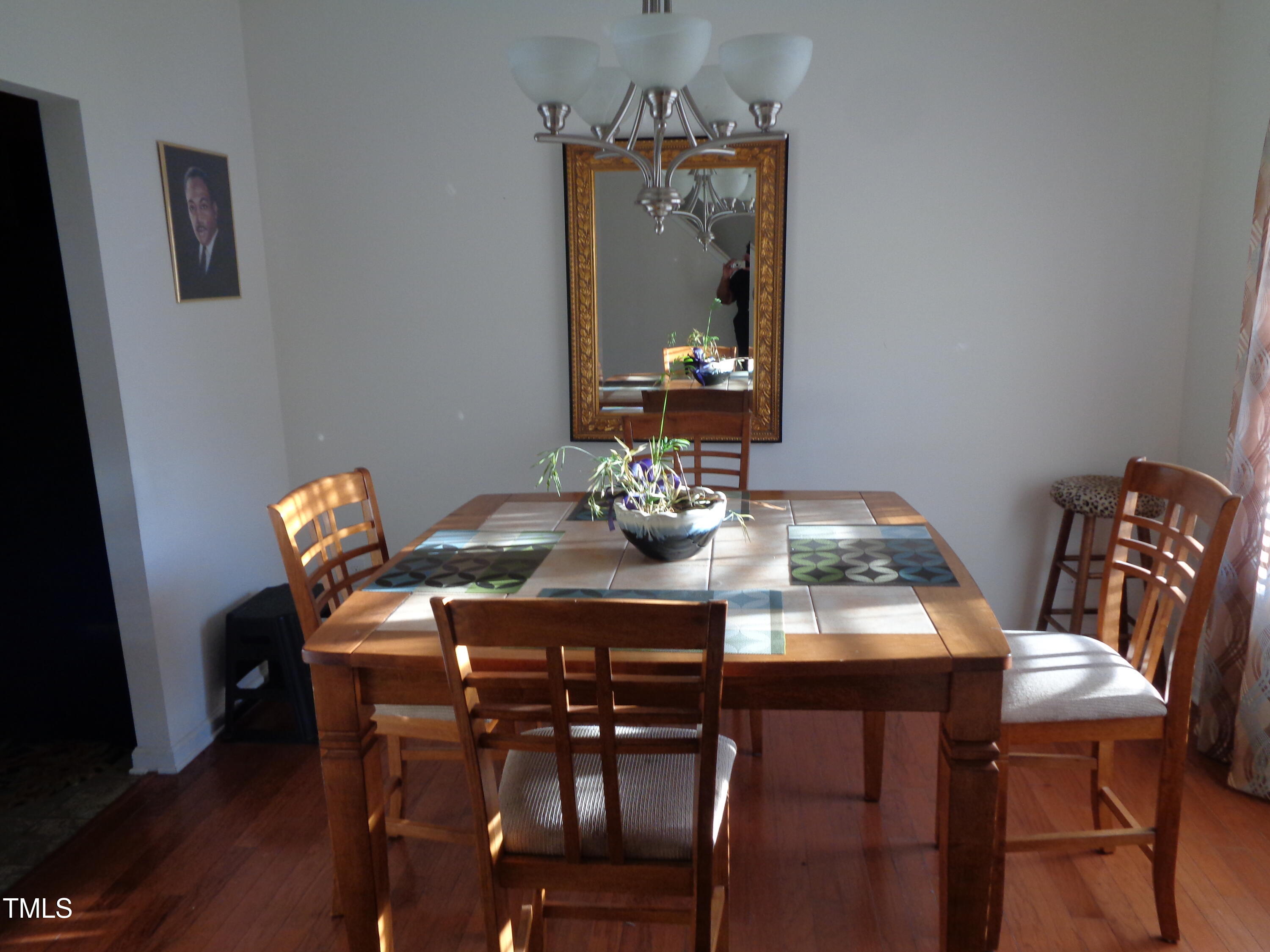 308 Switchback Street Knightdale, NC 27545 - Photo 4 of 17 a view of a dining room with furniture and wooden floor