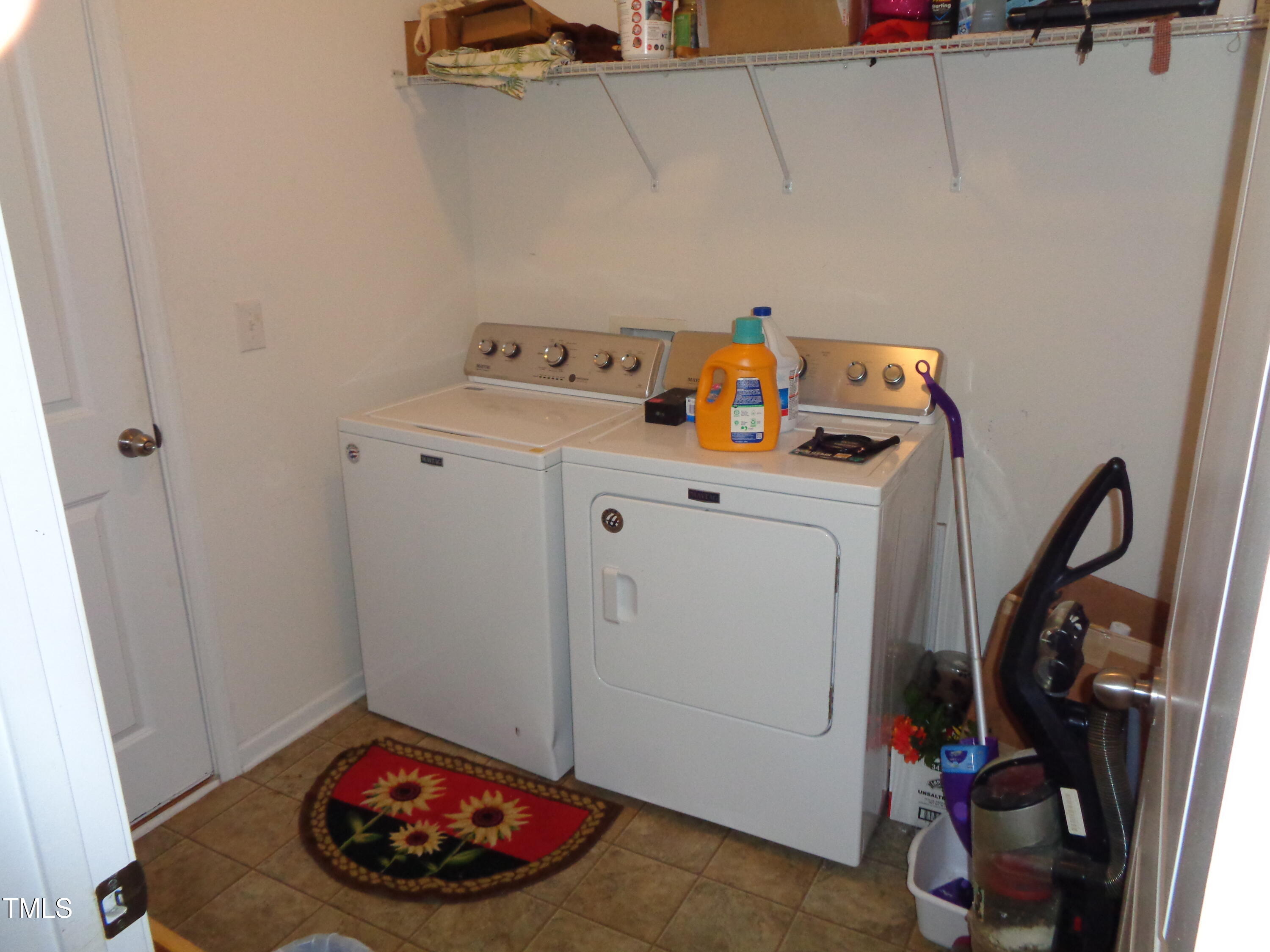 308 Switchback Street Knightdale, NC 27545 - Photo 6 of 17 a utility room with dryer and washer