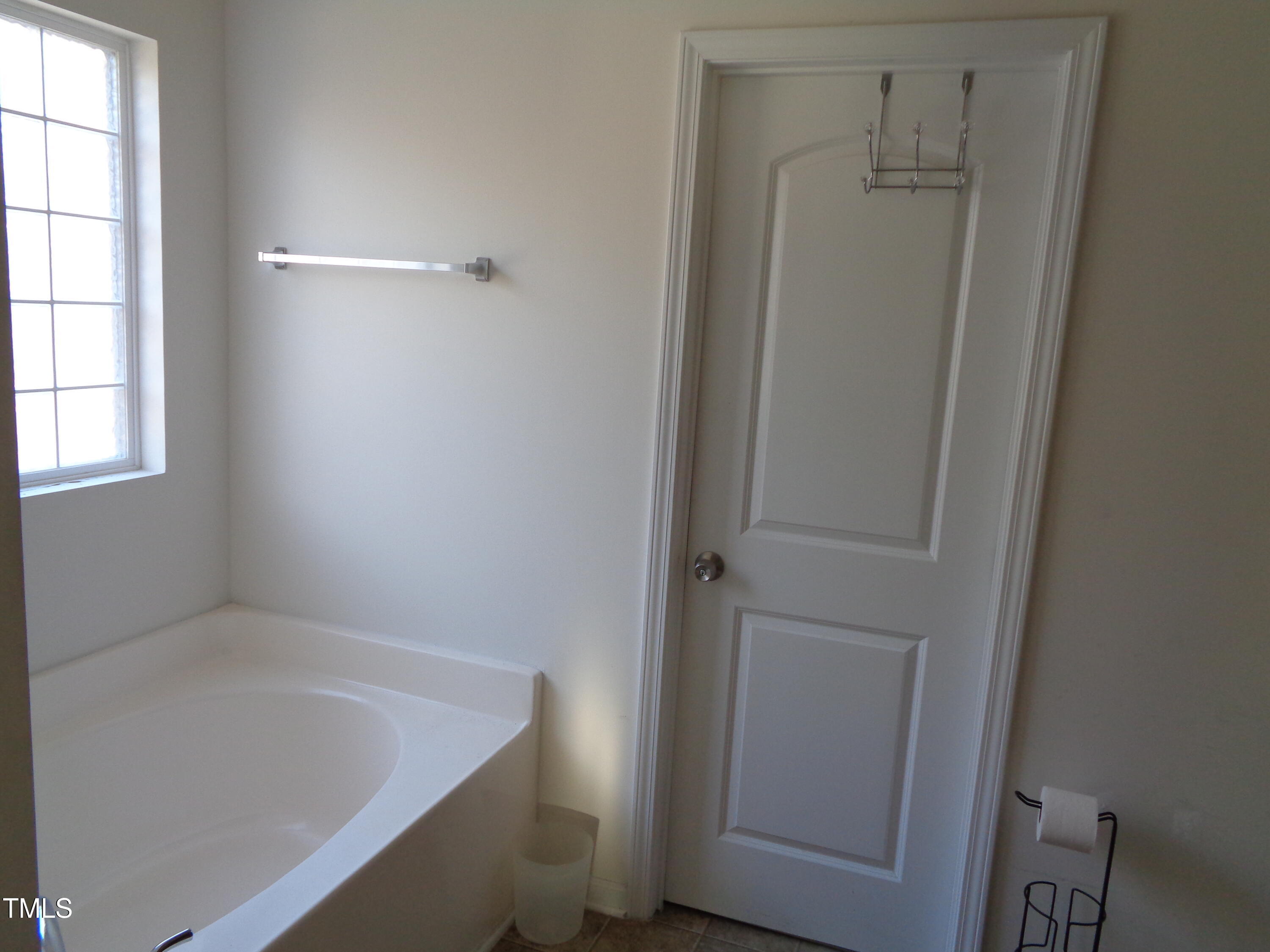308 Switchback Street Knightdale, NC 27545 - Photo 9 of 17 a bathroom with a bathtub