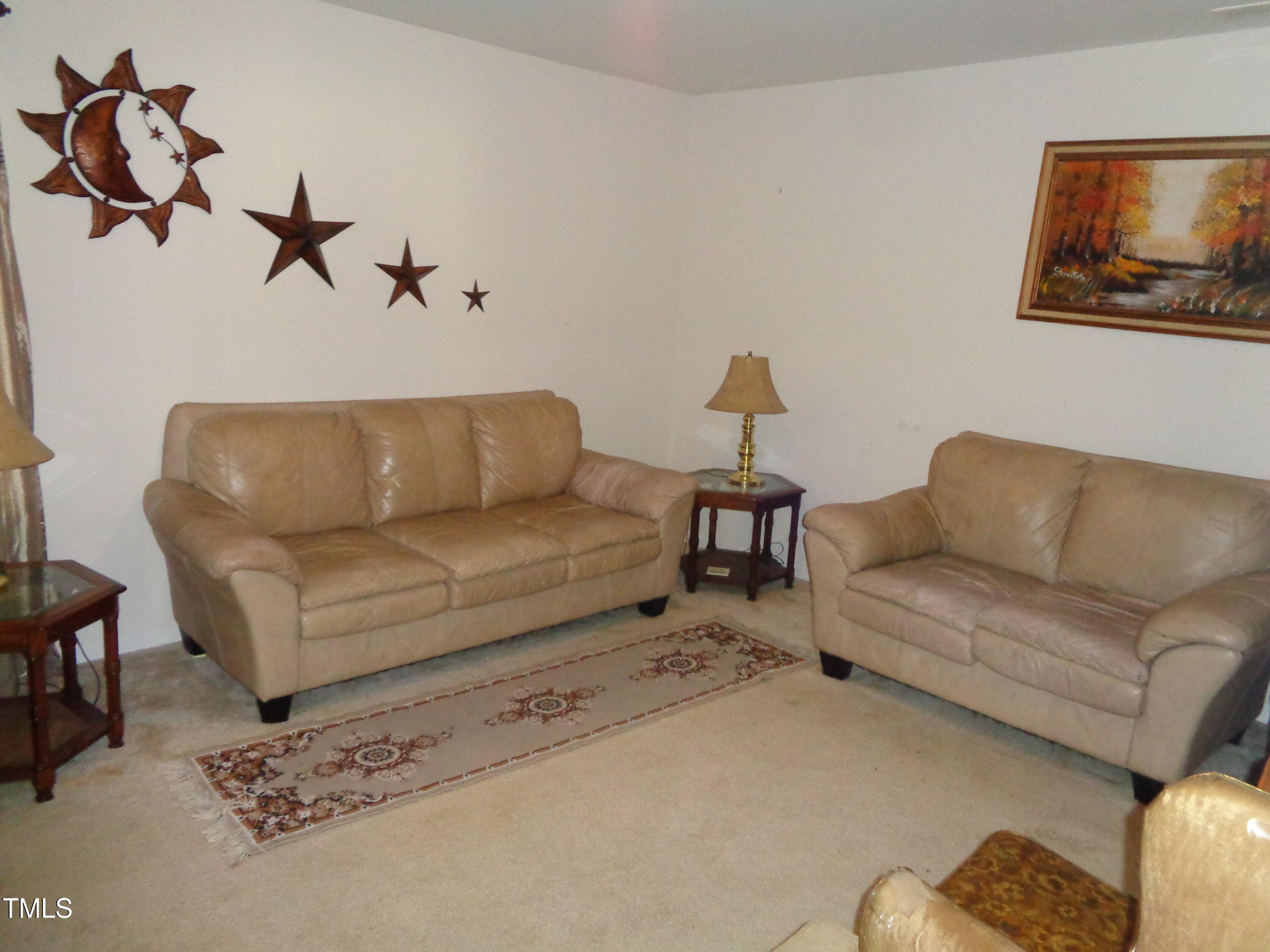 308 Switchback Street Knightdale, NC 27545 - Photo 10 of 17 a living room with furniture and a couch