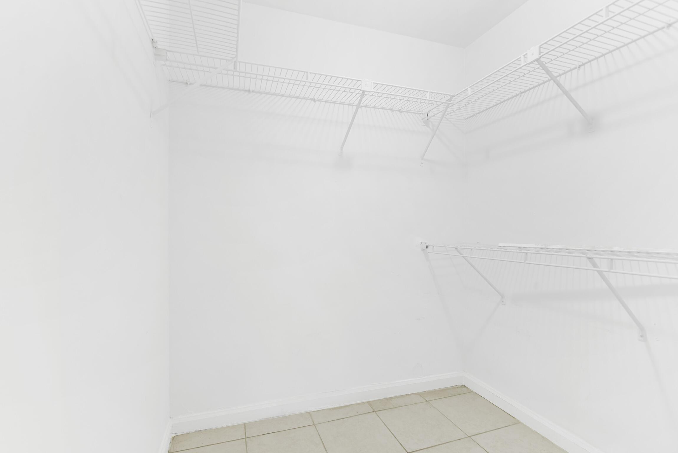 3129 Millwood Terrace, Unit M137 Boca Raton, FL 33431 - Photo 18 of 58 Walk-in closet