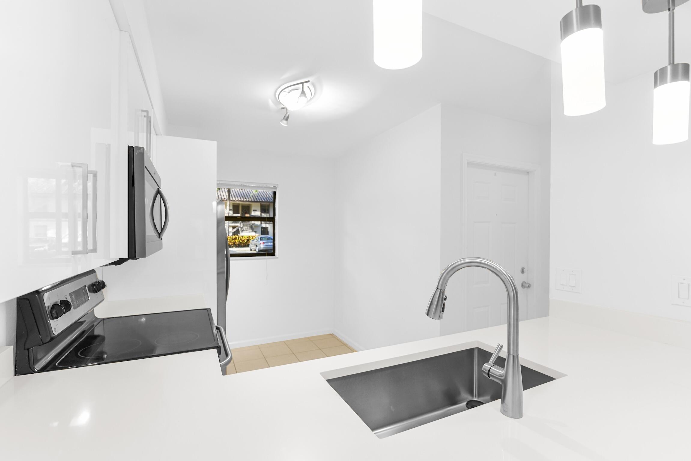 3129 Millwood Terrace, Unit M137 Boca Raton, FL 33431 - Photo 7 of 58 Kitchen