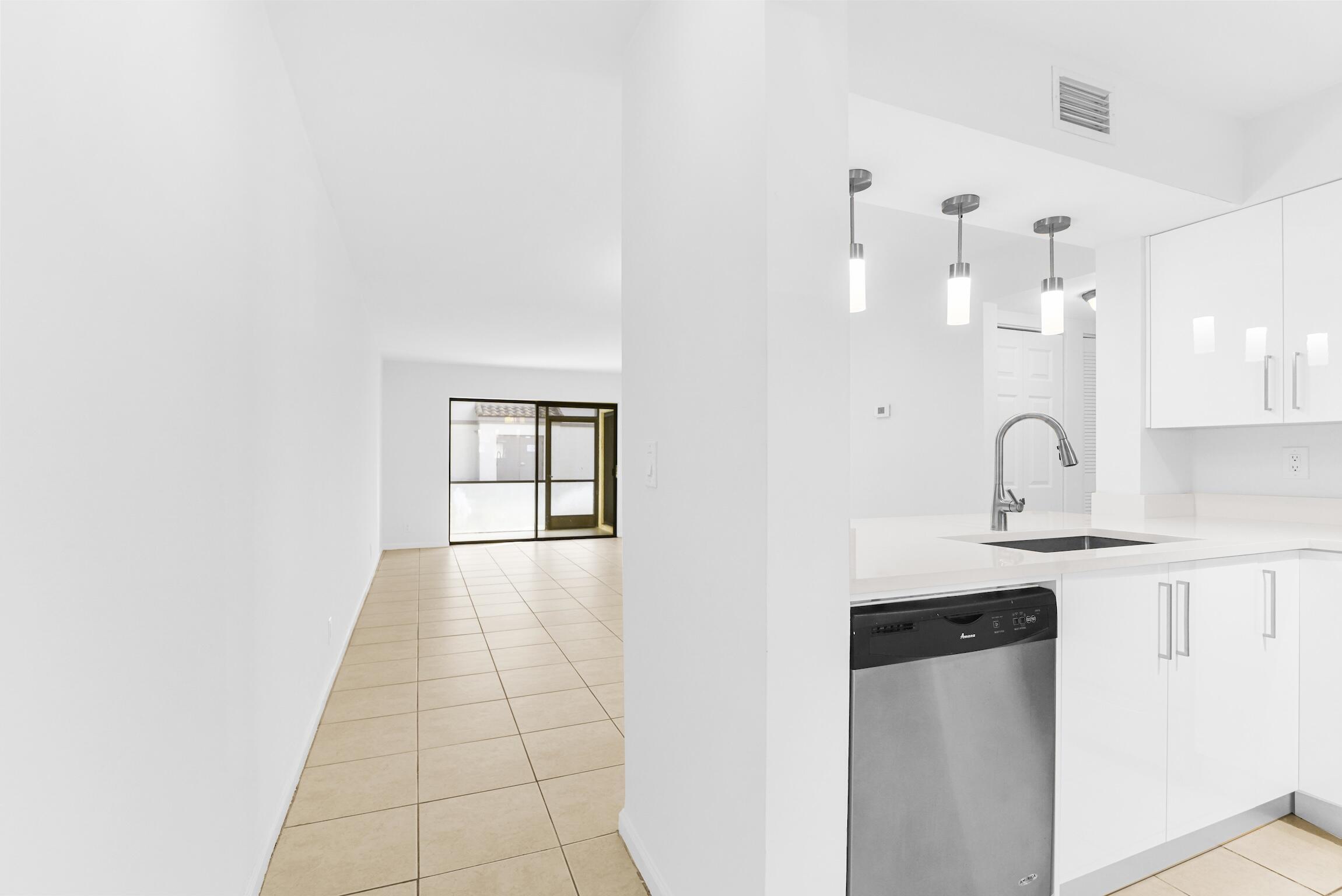 3129 Millwood Terrace, Unit M137 Boca Raton, FL 33431 - Photo 8 of 58 Kitchen entrance