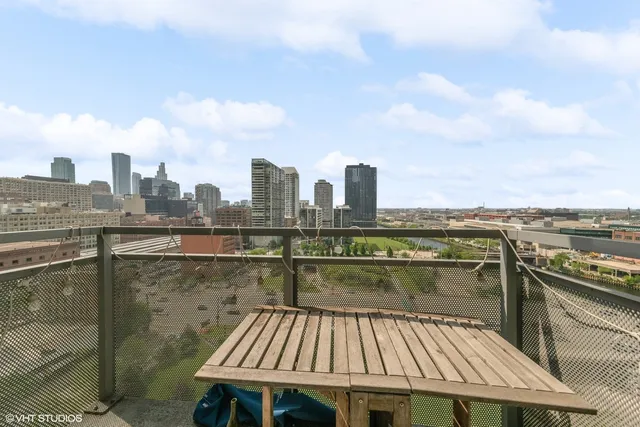 a view of a balcony with city