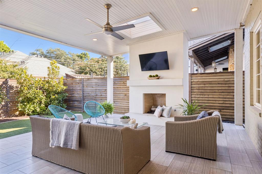 7423 Marquette Street Dallas, TX 75225 - Photo 22 of 31 Covered patio with fireplace perfect for entertaining.