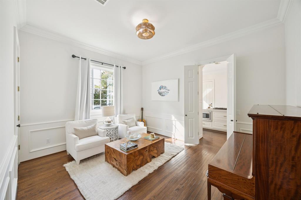 7423 Marquette Street Dallas, TX 75225 - Photo 30 of 31 This paneled room was originally the dining room for the property, connecting to the kitchen, but flexibility of floor plan allows for multiple options.