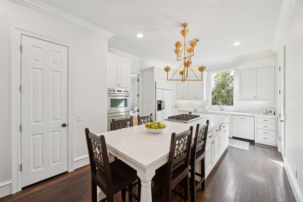 7423 Marquette Street Dallas, TX 75225 - Photo 8 of 31 Updated kitchen has walk-in pantry and a door to the attached 2-car garage.