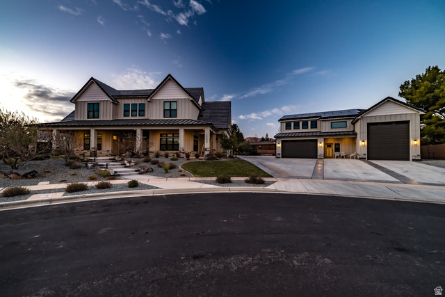1283 North Gallen Road Santa Clara, UT 84765 - Photo 92 of 103 Modern inspired farmhouse featuring board and batten siding, covered porch, concrete driveway, and roof mounted solar panels