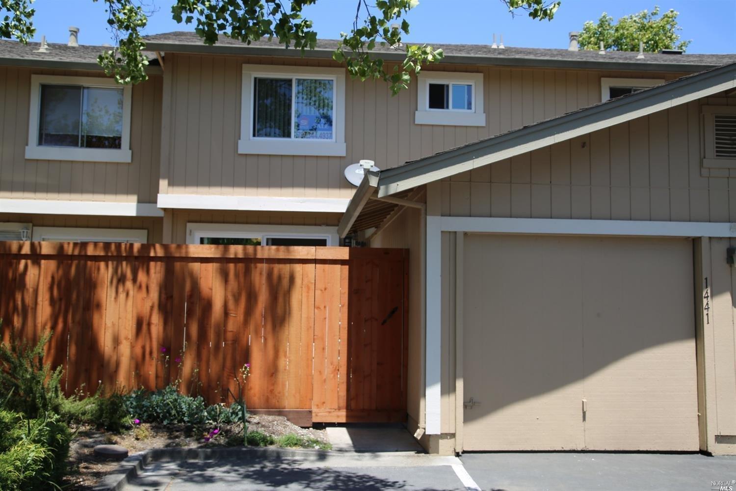 a front view of a house with a garage