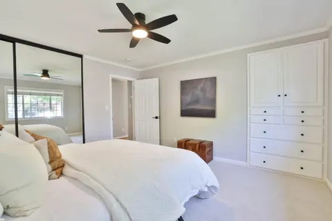 a bedroom with a bed and a closet