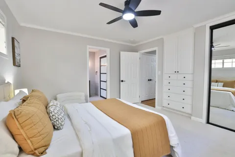 a bedroom with a bed and a walk in closet