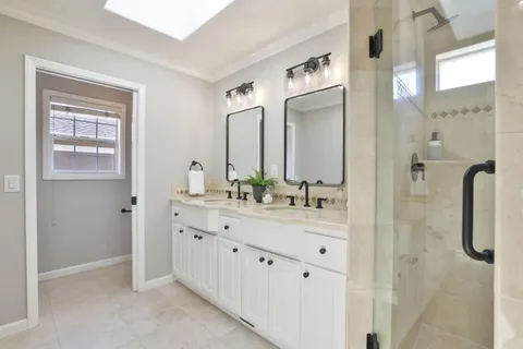 a bathroom with a bathtub and shower