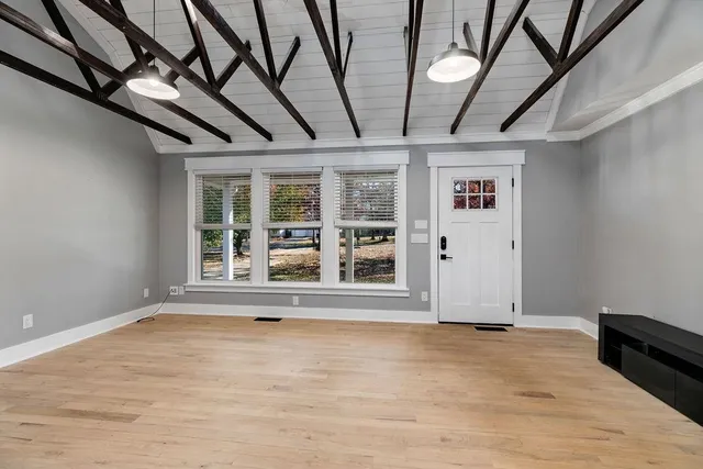 a view of an empty room with a window