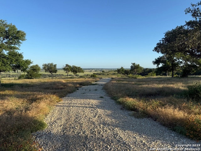 Lot 45 Cr 511 Hamilton, TX 76531 - Photo 3 of 7 a view of a lake with beach and large trees