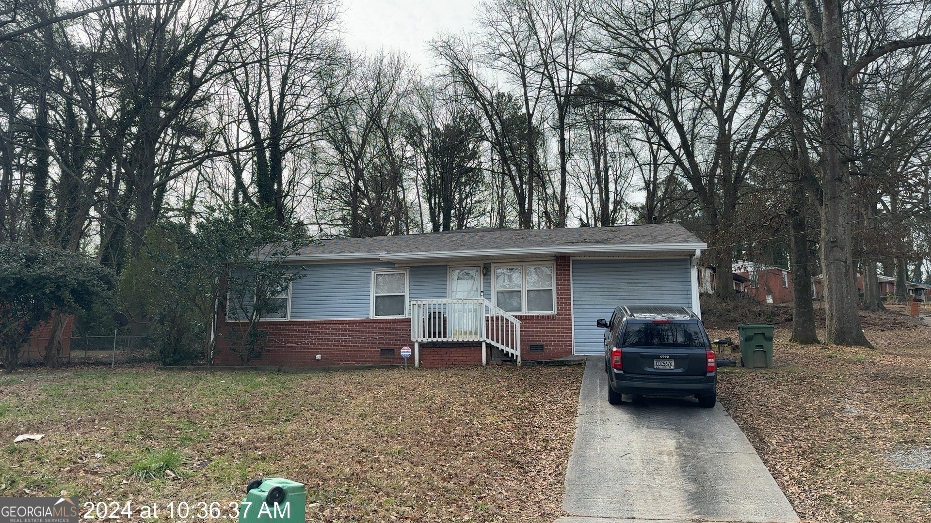 920 Fairburn Road Northwest Atlanta, GA 30331 - Photo 1 of 1 a view of a house with a backyard and trees