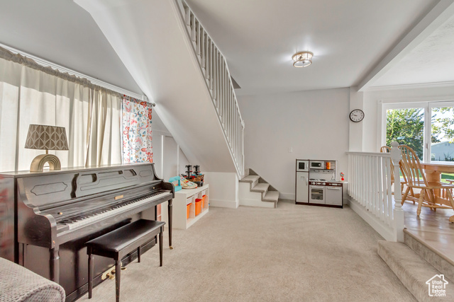 360 East Center Street Centerville, UT 84014 - Photo 20 of 41 Living area featuring stairs and light carpet