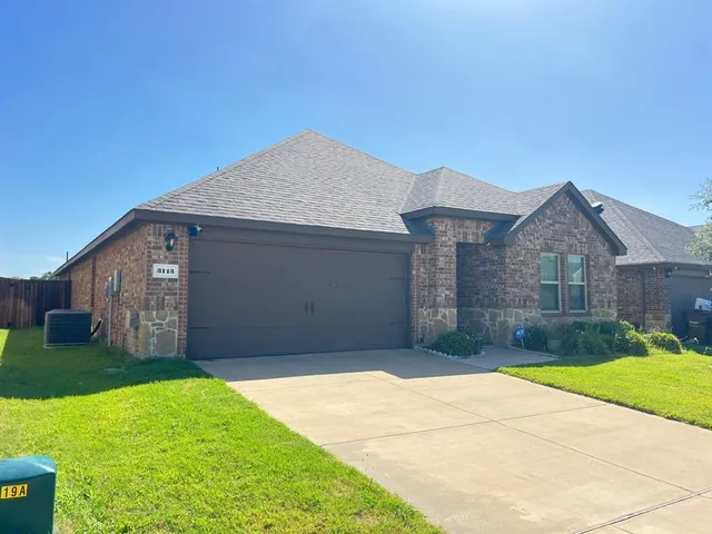 a front view of a house with yard
