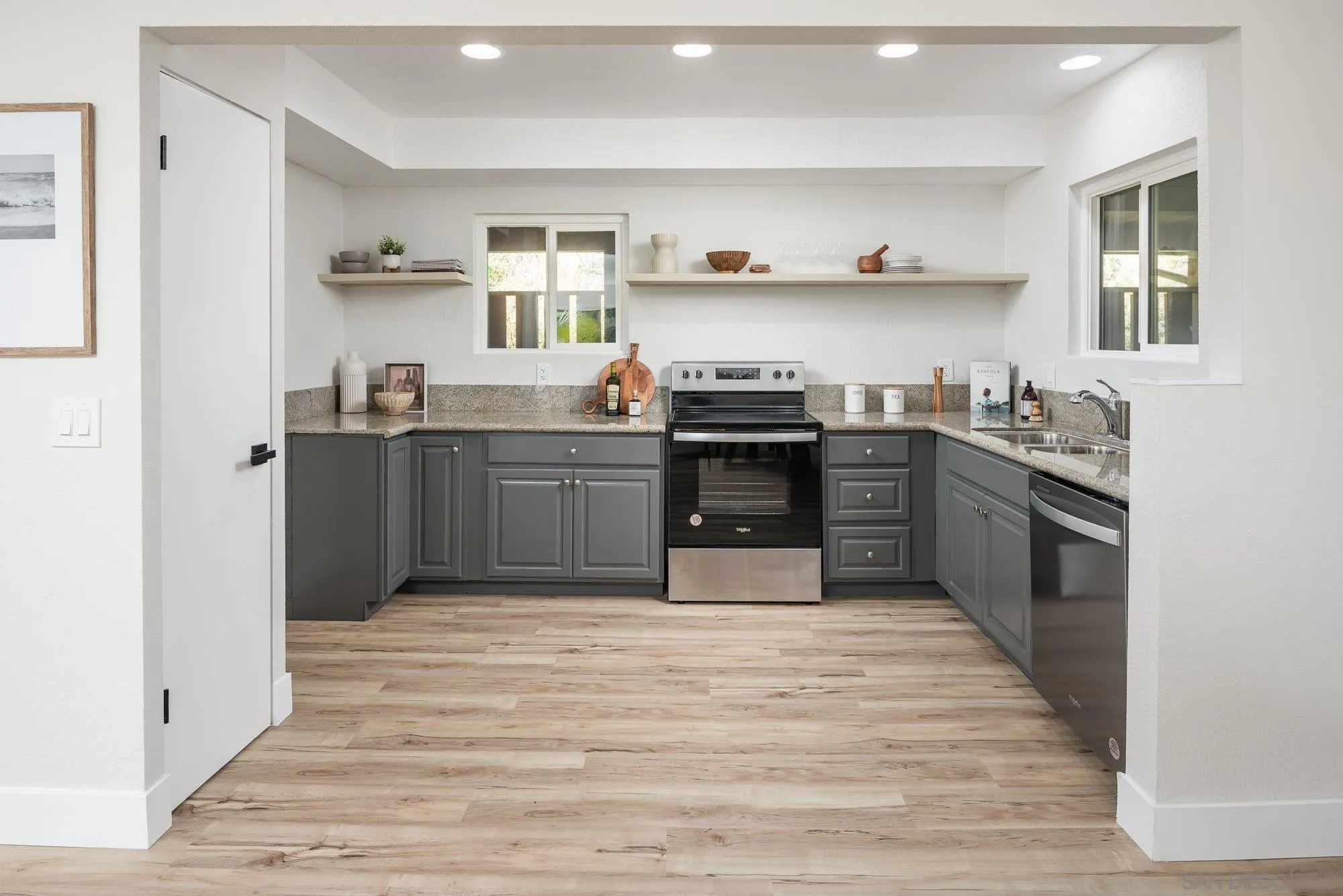 2610 Torrey Pines Road, Unit C33 La Jolla, CA 92037 - Photo 7 of 24 a kitchen with stainless steel appliances granite countertop a stove and a sink