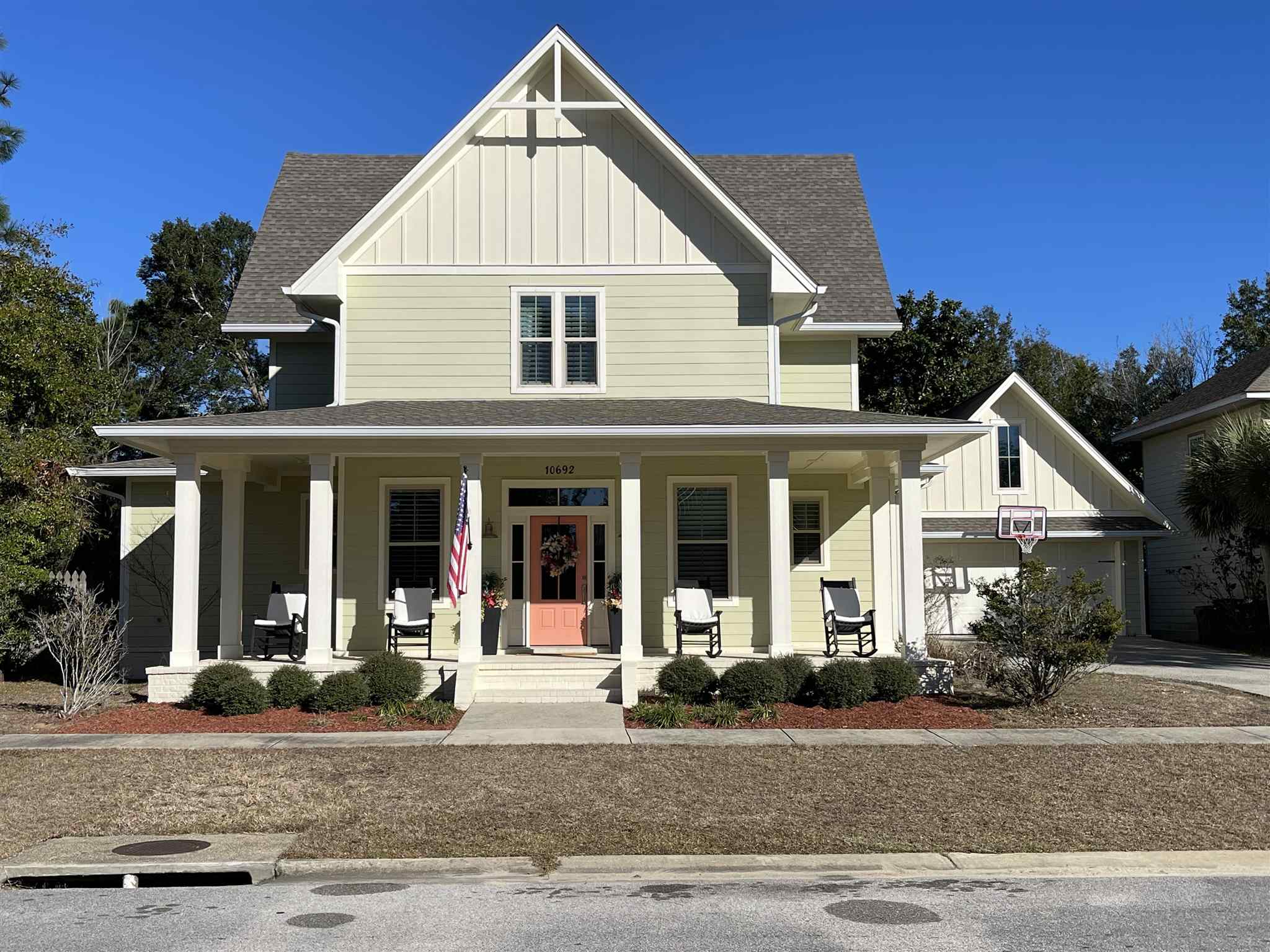 10692 Squall Line Road Pensacola, FL 32507 - Photo 1 of 29 a view of a white house with a outdoor space