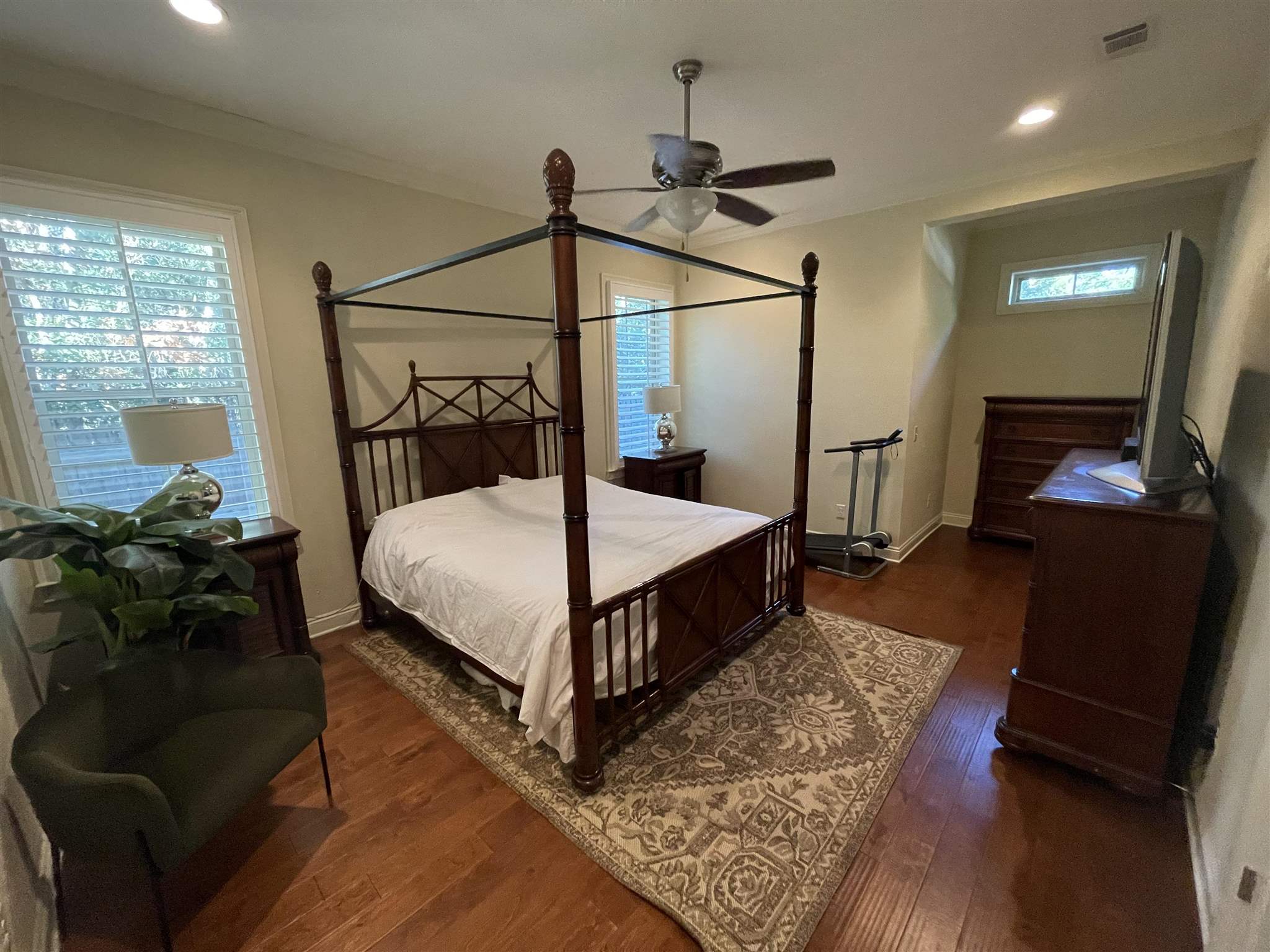 10692 Squall Line Road Pensacola, FL 32507 - Photo 14 of 29 a bedroom with a bed a window and wooden floor