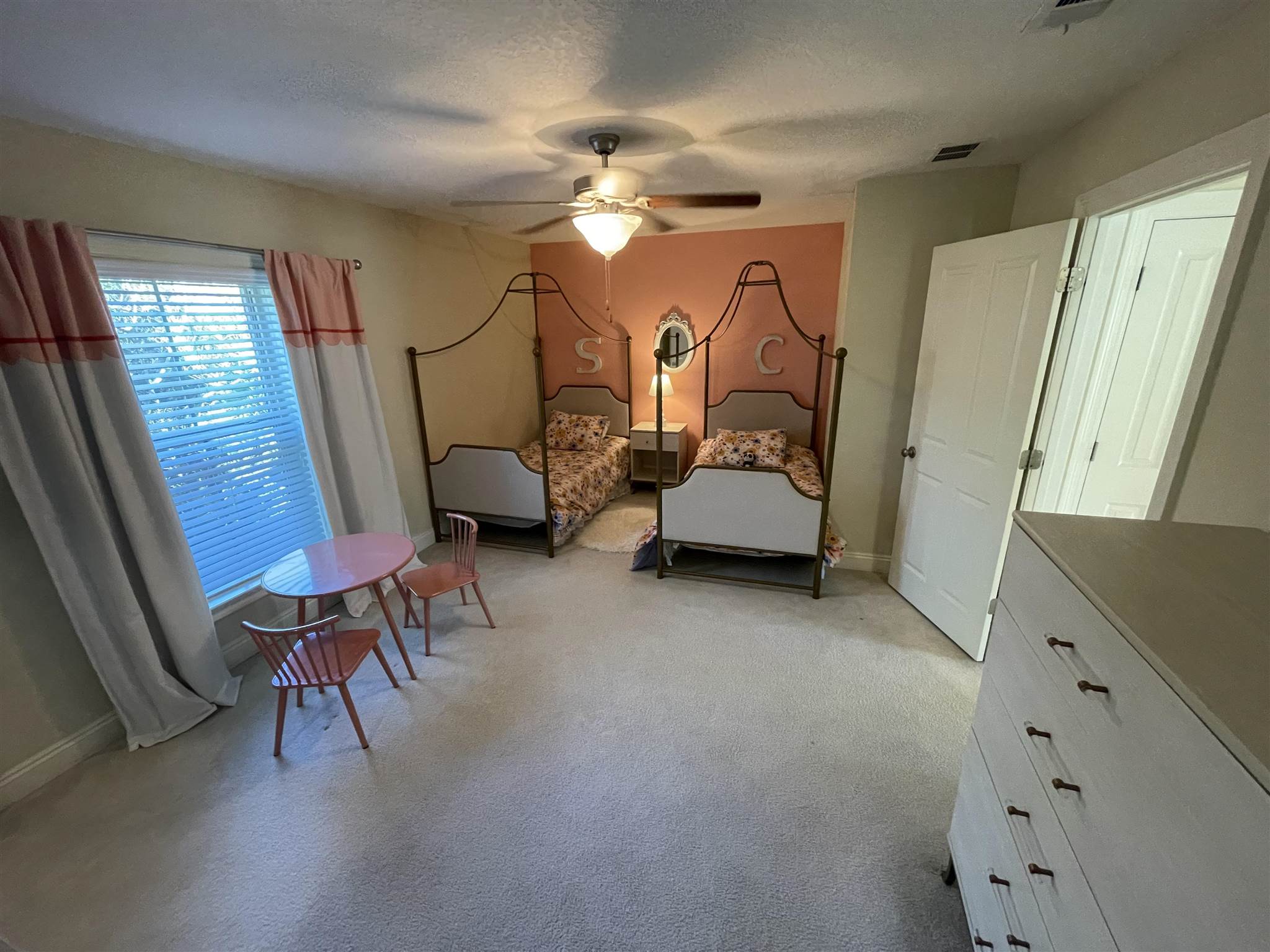 10692 Squall Line Road Pensacola, FL 32507 - Photo 18 of 29 a bedroom with furniture and a mirror
