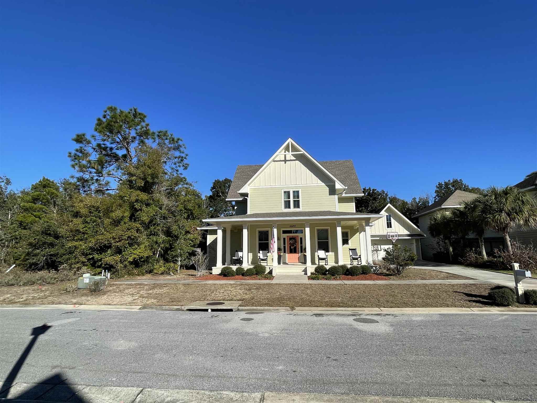 10692 Squall Line Road Pensacola, FL 32507 - Photo 2 of 29 a front view of a house with a yard