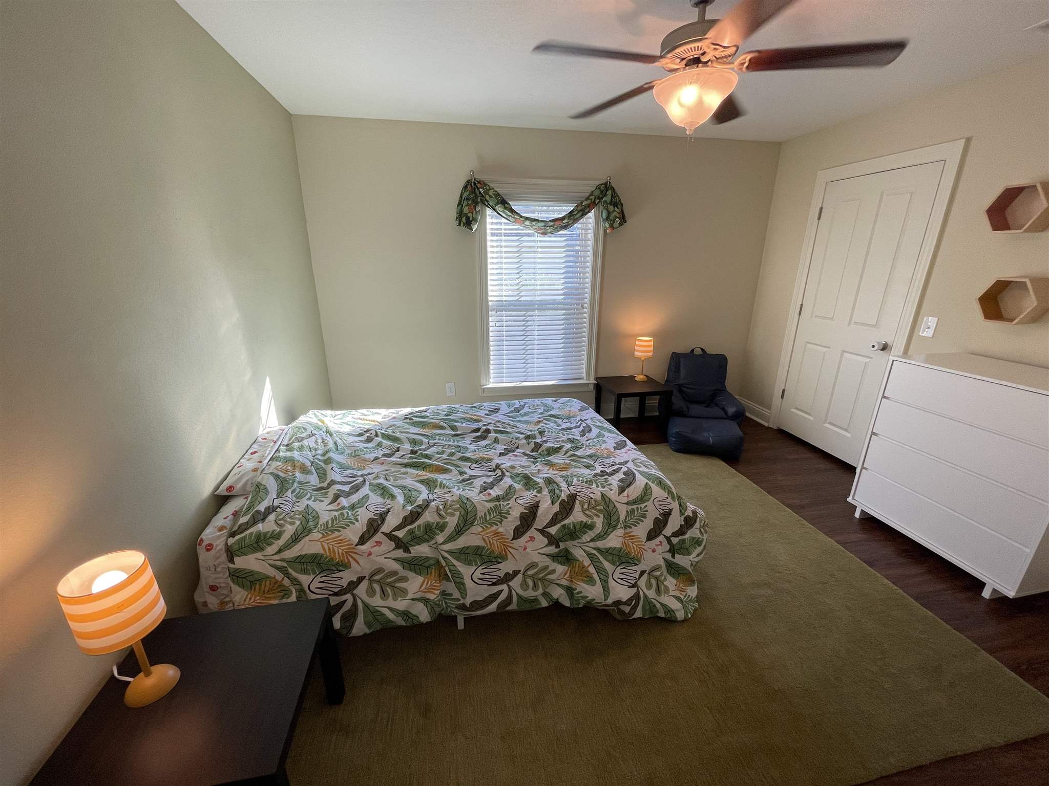 10692 Squall Line Road Pensacola, FL 32507 - Photo 21 of 29 a bedroom with a bed and a chandelier