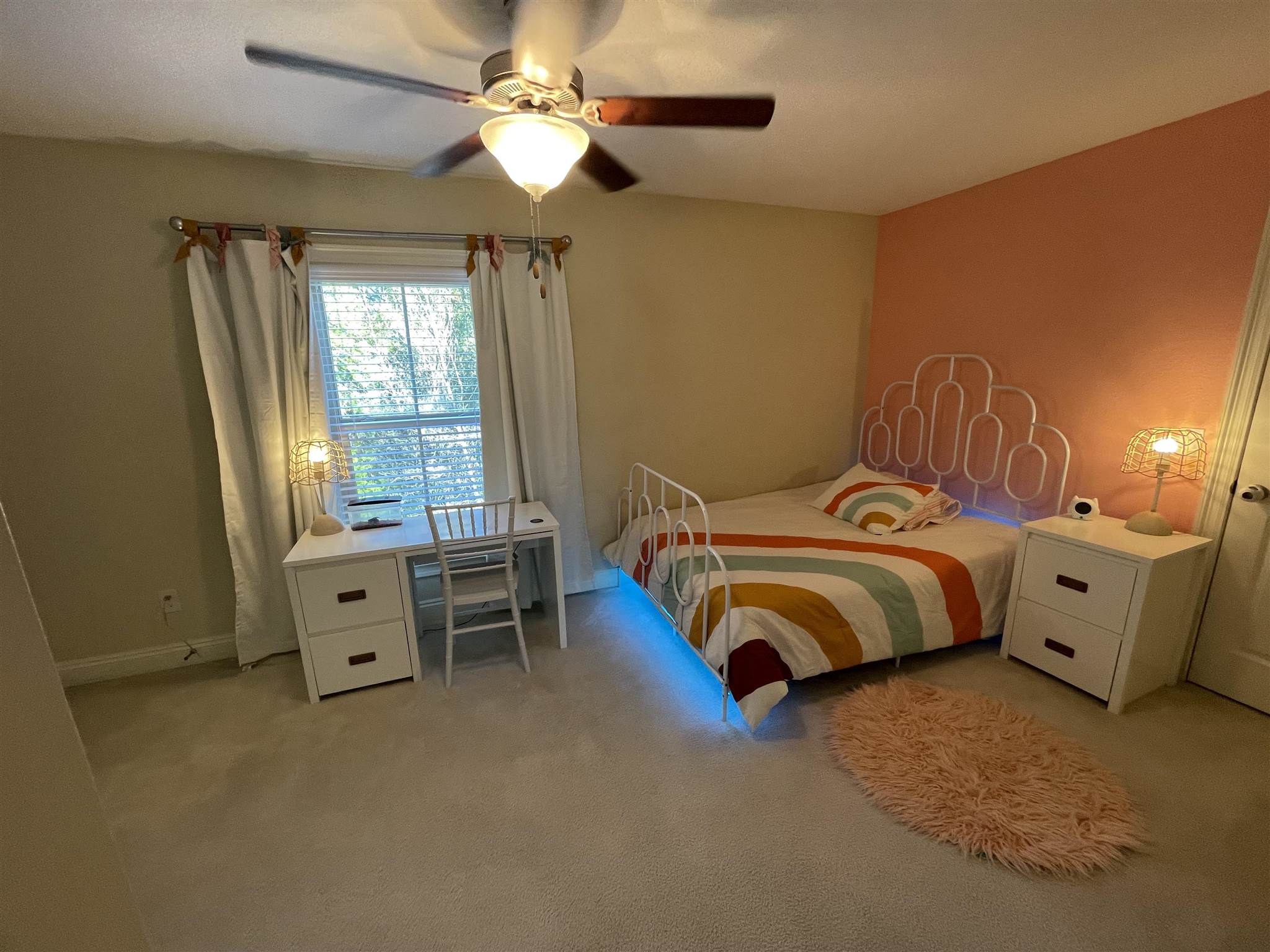 10692 Squall Line Road Pensacola, FL 32507 - Photo 24 of 29 a bedroom with a bed and a chandelier
