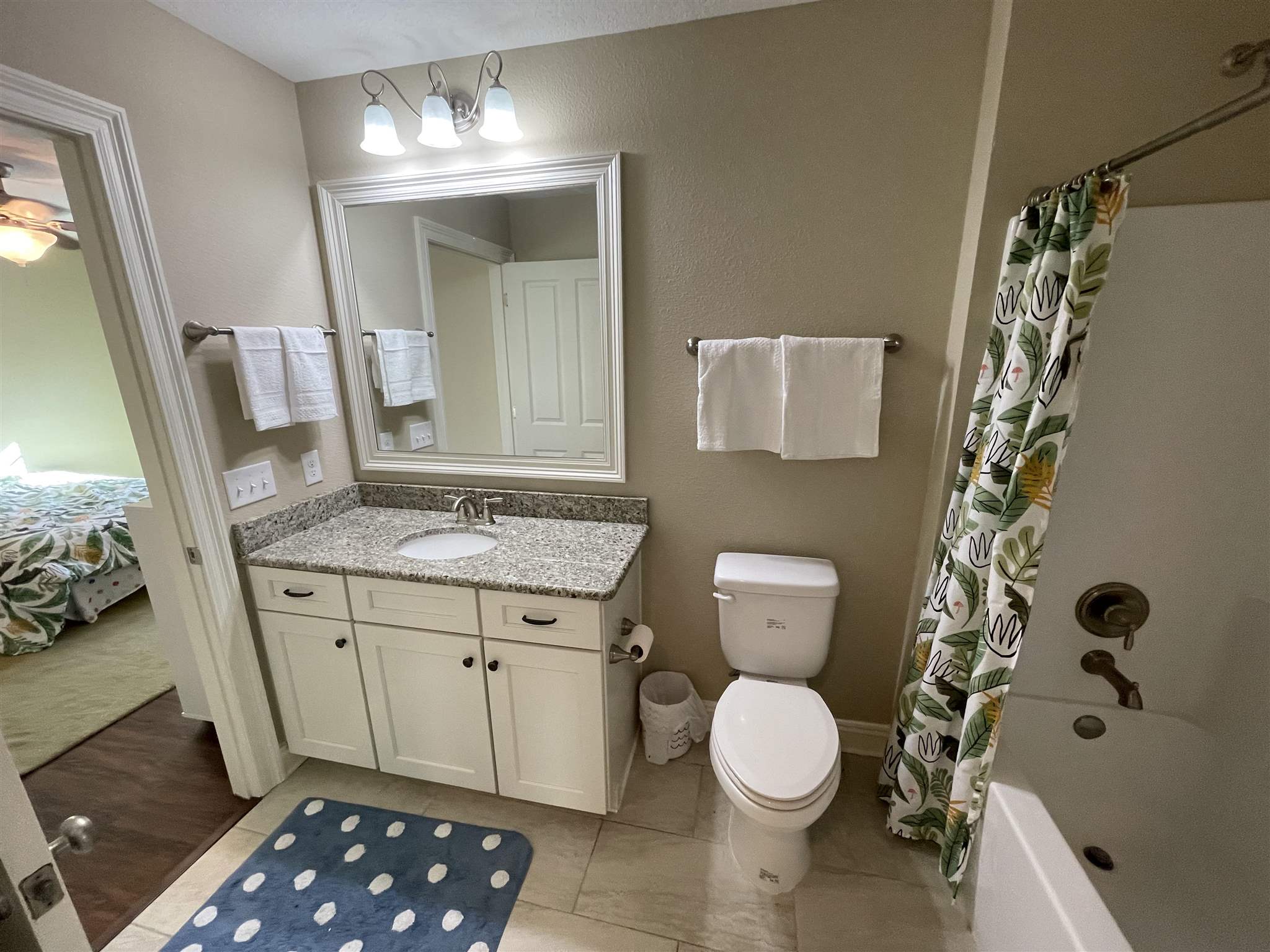 10692 Squall Line Road Pensacola, FL 32507 - Photo 26 of 29 a bathroom with a granite countertop sink toilet and shower
