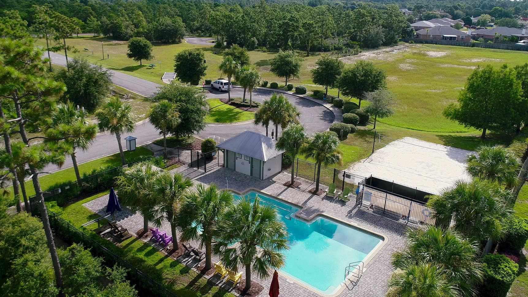10692 Squall Line Road Pensacola, FL 32507 - Photo 29 of 29 an aerial view of residential houses with outdoor space and swimming pool
