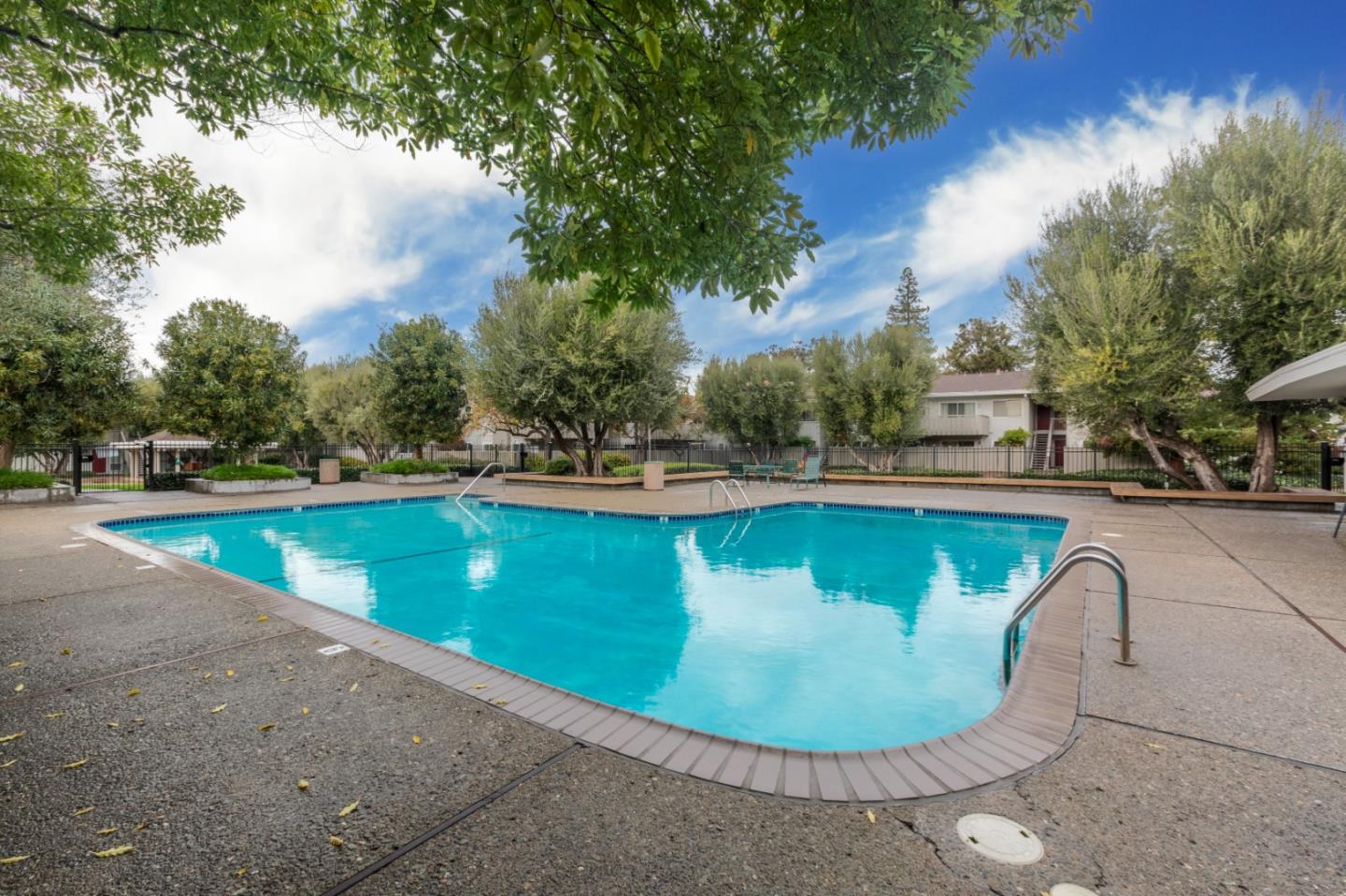 255 South Rengstorff Avenue, Unit 96 Mountain View, CA 94040 - Photo 18 of 20 a view of a swimming pool with a yard