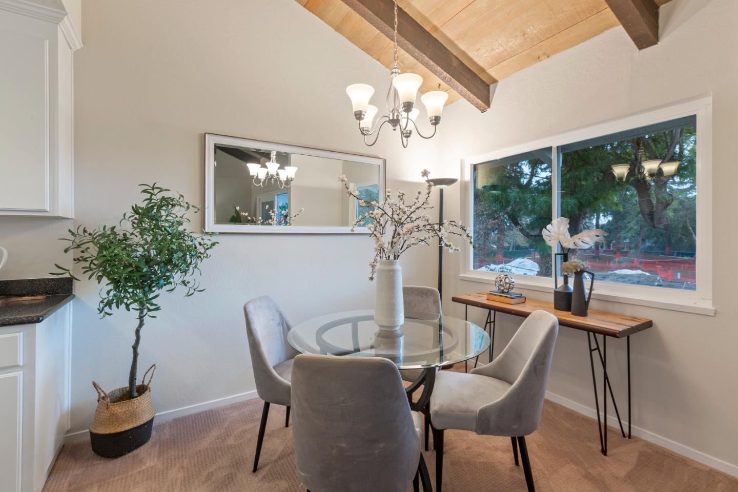 255 South Rengstorff Avenue, Unit 96 Mountain View, CA 94040 - Photo 7 of 20 a dining room with furniture a chandelier and window