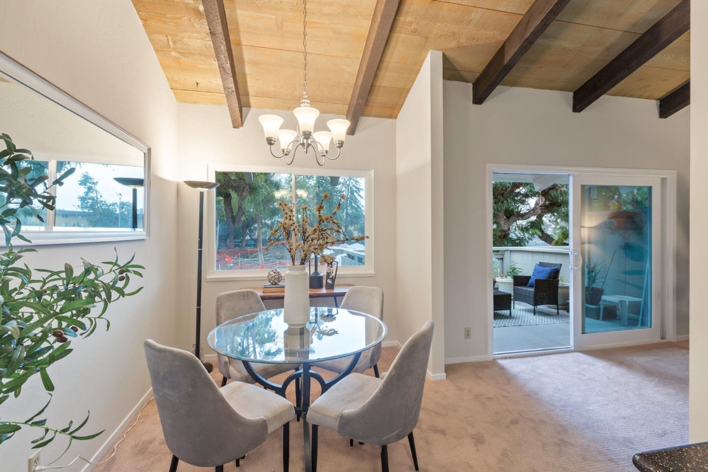 255 South Rengstorff Avenue, Unit 96 Mountain View, CA 94040 - Photo 8 of 20 a view of a dining room with furniture wooden floor and chandelier