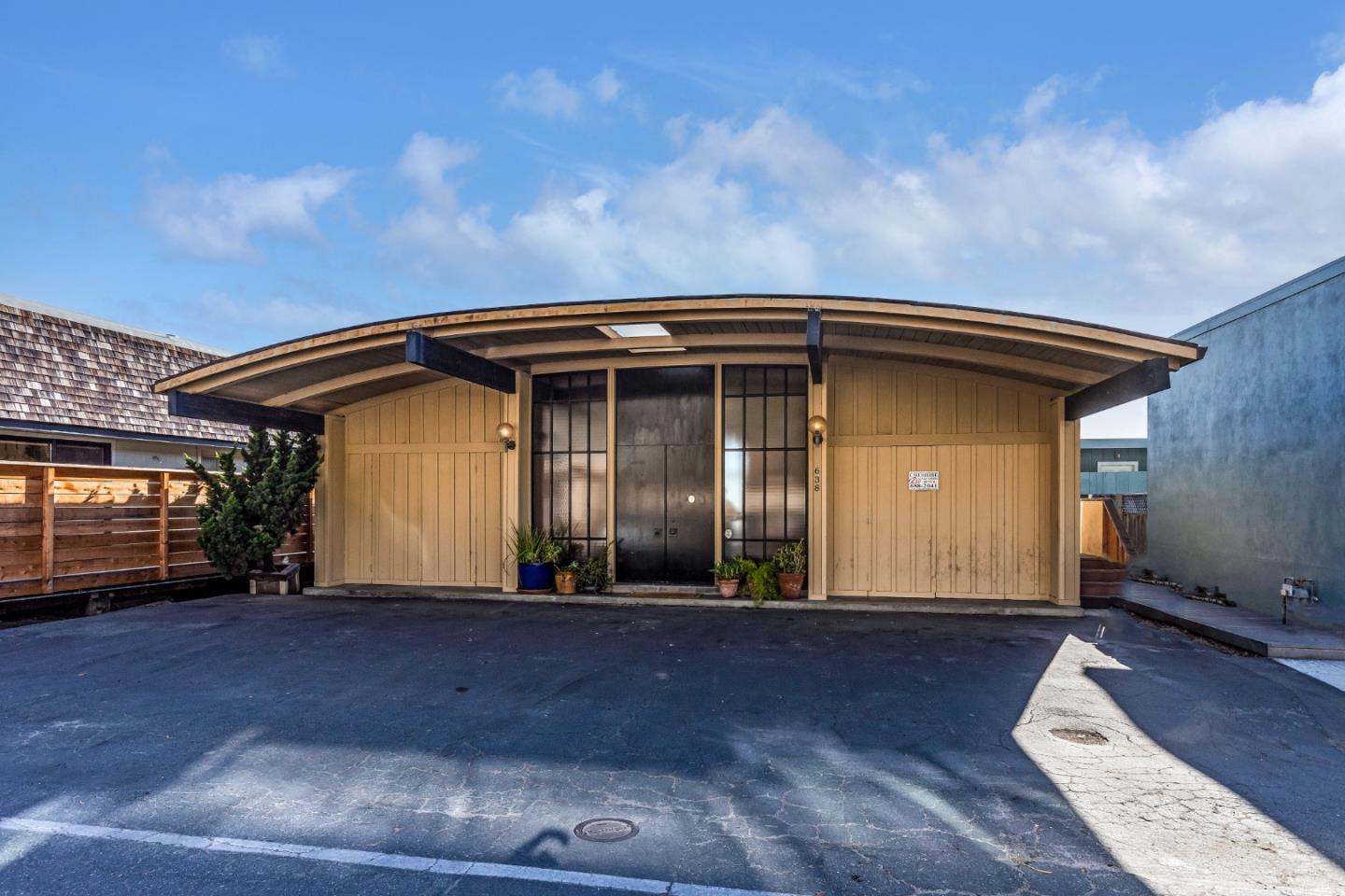 638 Beach Drive Aptos, CA 95003 - Photo 14 of 40 a front view of a house with a garden