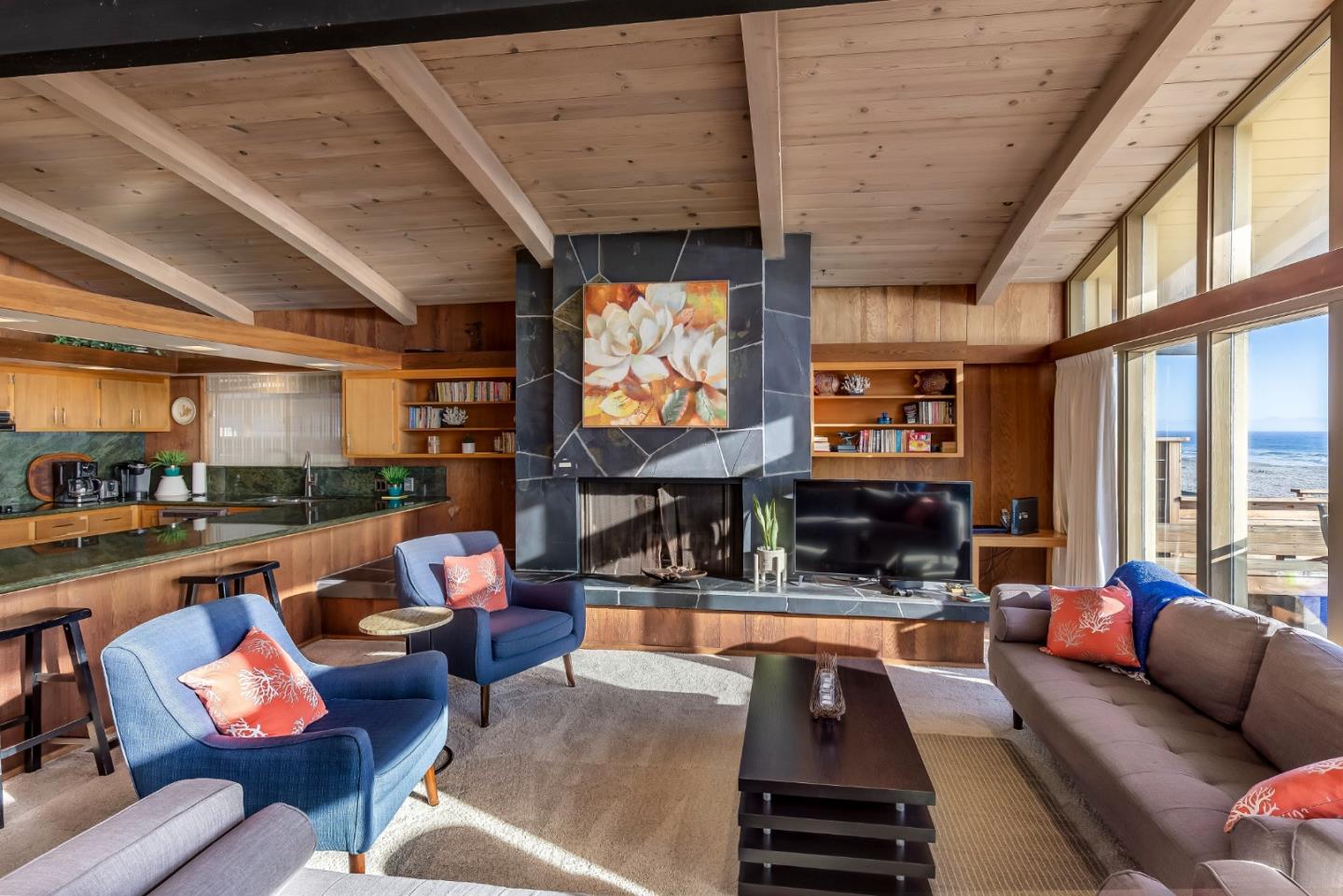 638 Beach Drive Aptos, CA 95003 - Photo 19 of 40 a living room with fireplace furniture and a large window