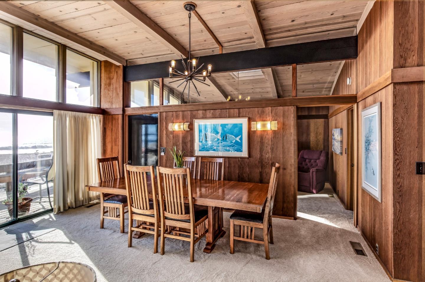 638 Beach Drive Aptos, CA 95003 - Photo 20 of 40 a dining room with furniture a chandelier and wooden floor