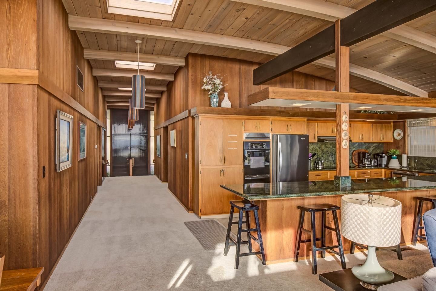 638 Beach Drive Aptos, CA 95003 - Photo 22 of 40 a view of a patio with table and chairs a barbeque