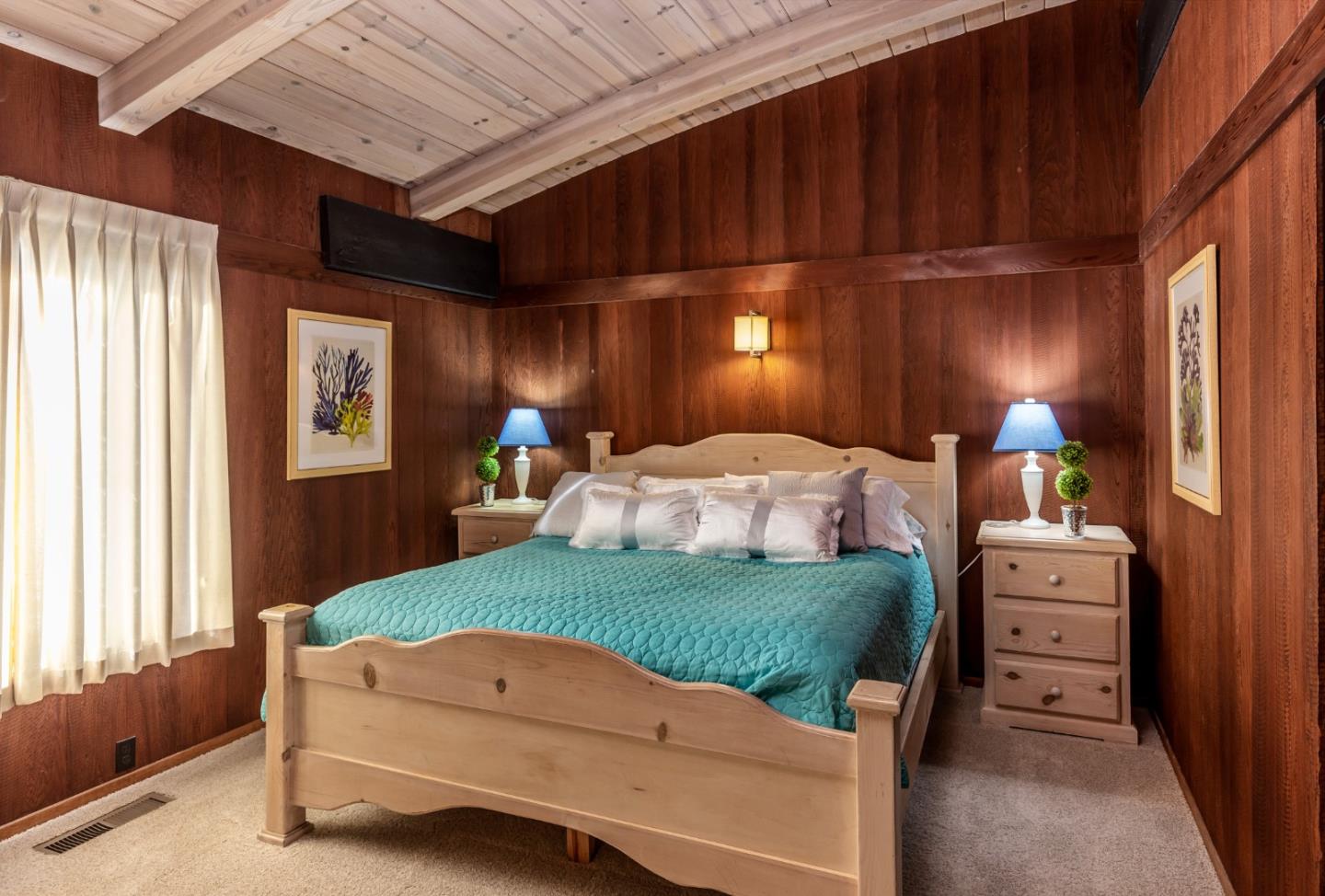 638 Beach Drive Aptos, CA 95003 - Photo 27 of 40 a bedroom with a bed and a dresser