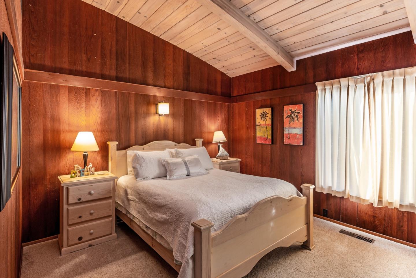 638 Beach Drive Aptos, CA 95003 - Photo 28 of 40 a bedroom with a bed and a lamp with the dresser